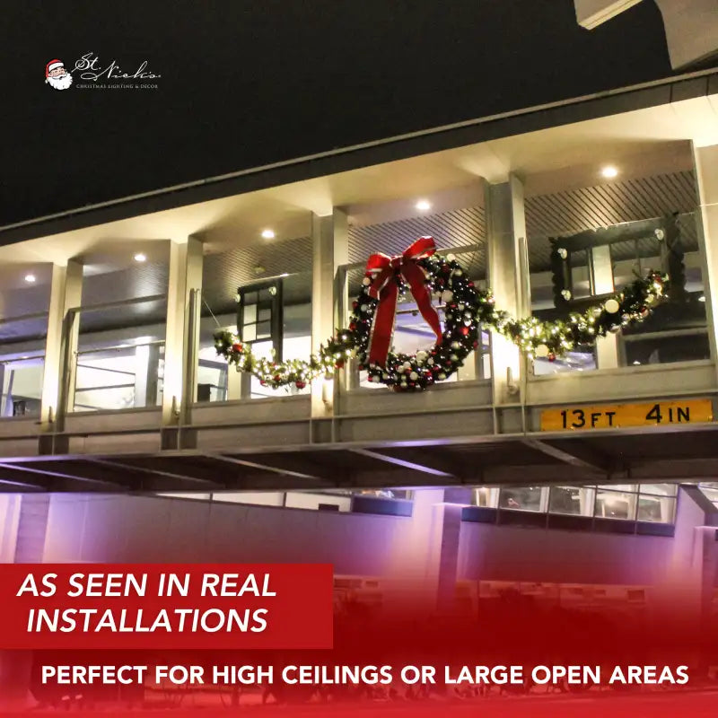 Building exterior with Christmas wreaths and garland decorations