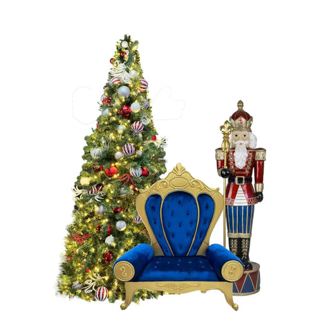 Decorative Christmas scene with a blue throne, nutcracker, and decorated tree