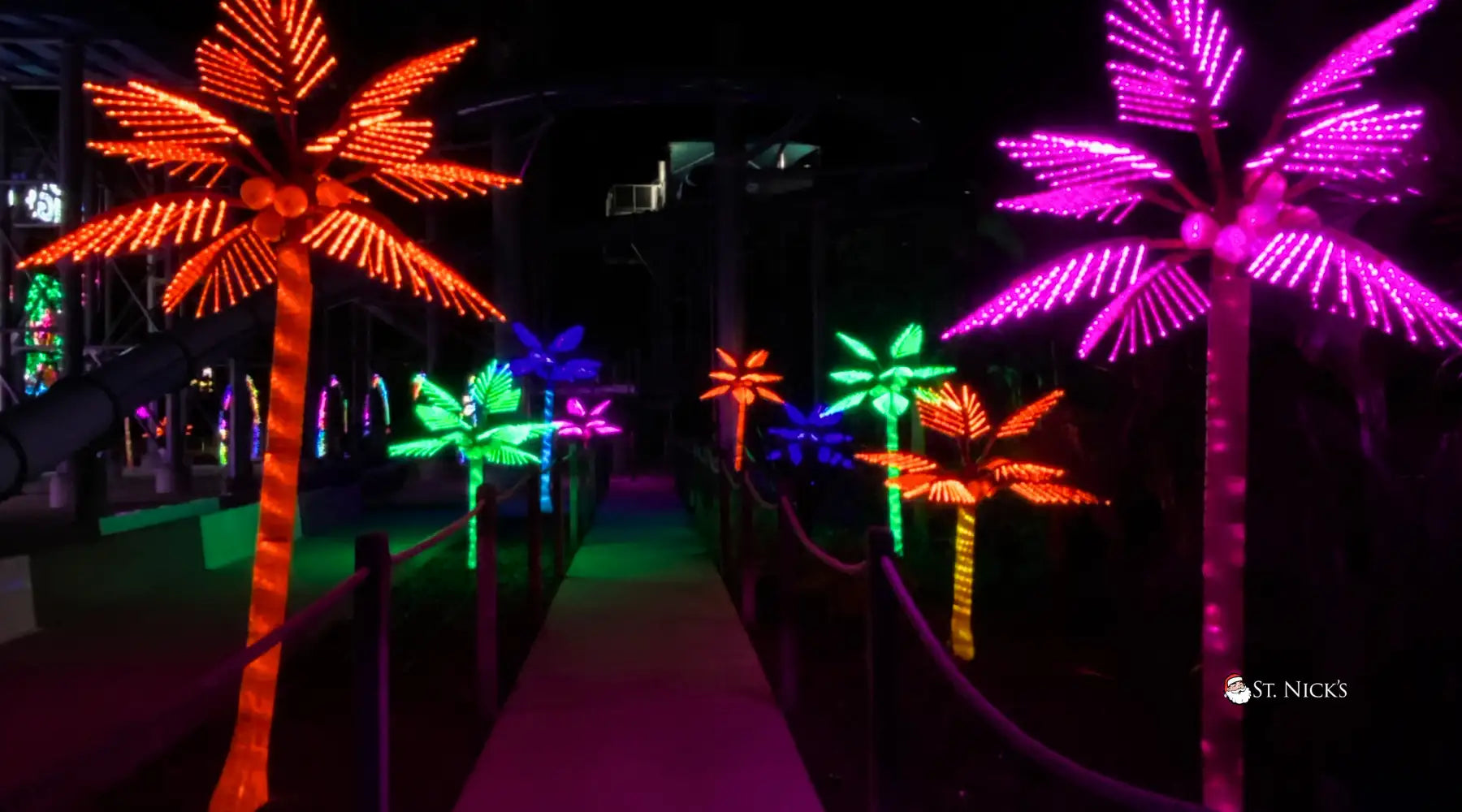 Colorful illuminated palm trees lighting installation Kissimmee, FL