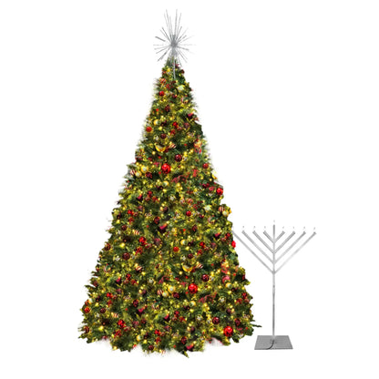 Decorated Christmas tree with lights and ornaments next to a Menorah 